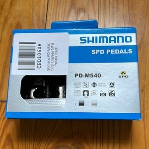 Unopened Shimano SPD pedals and cleats